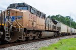 UP 5568 trails on an eastbound grain train